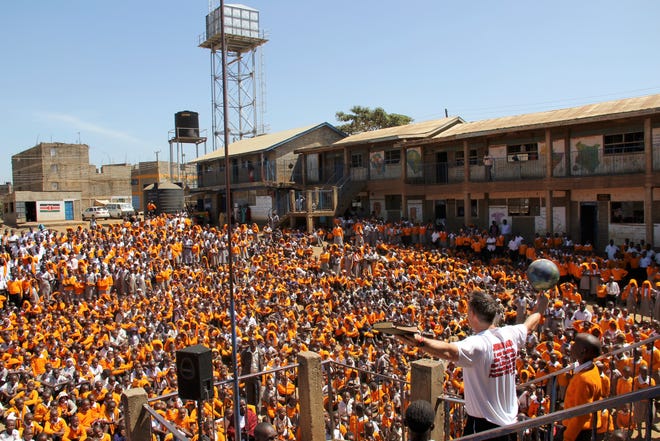 Crossfire Ministries' co-founder Randy Shepherd speaks to a large crowd during a trip to Kenya.