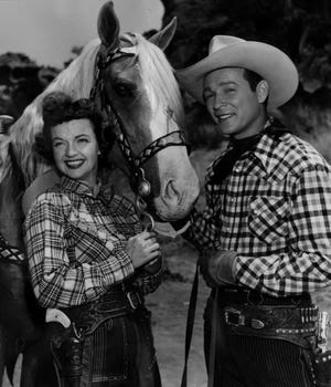 1952: Roy Rogers, right, with is wife Dale Evans, left, and horse Trigger, center.