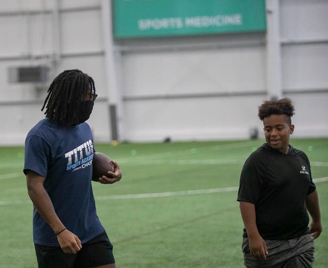 Darnell Savage of the Green Bay Packers has a one-on-one conversation at a free NFL clinic for youths at Chase Fieldhouse, Friday, June 17, 2022.