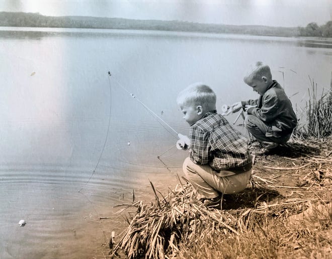 Jerry Apps' sons, Jeff, right, and Steve try their skills (and patience) at fishing.