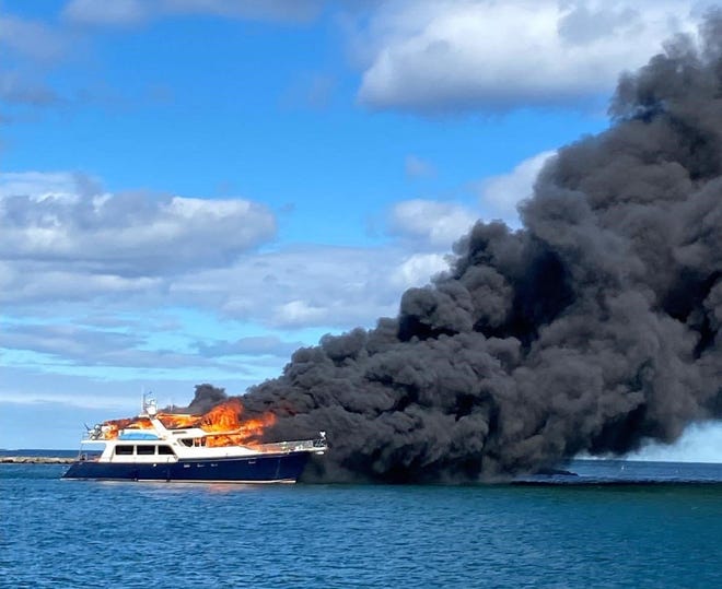 A 70-foot Marlow yacht is on fire off the coast of New Castle Saturday, June 18, 2022.