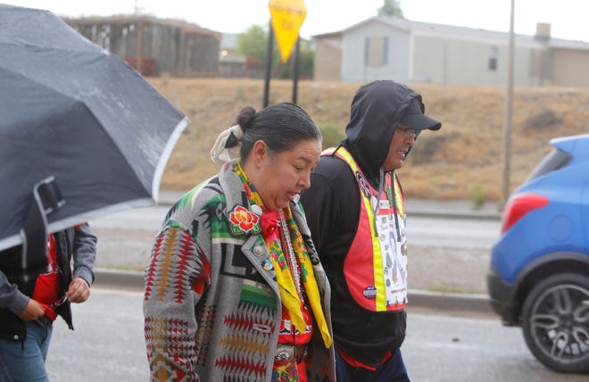 Navajo Nation Council Delegate Amber Kanazbah Crotty, center, participates in a walk in Shiprock on May 23, 2019 to raise awareness about missing and murdered Indigenous women and girls.