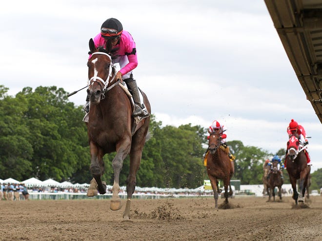 Home Brew, ridden by Paco Lopez, wins the $150,000 TVG.com Pegasus Stakes at Monmouth Park Racetrack in Oceanport on June 18, 2022.