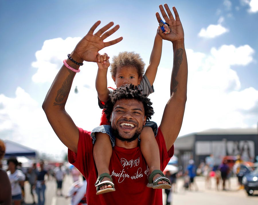 Tre Fairbanks dances with Zuri, 4, during Juneteenth on the East in Oklahoma City on June, 18.