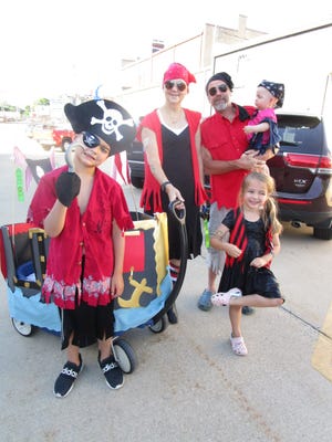 The Pirates were part of Geneseo’s Doo-Dah Parade held Friday, June 17, through downtown Geneseo as part of the Geneseo Music Fest activities. In pirate costumes are Olsen, Lucy and Eleanor Holschbach with grandparents Keith and Rhondda Homfeldt, Geneseo. The parade is sponsored by the Geneseo Kiwanis Club.