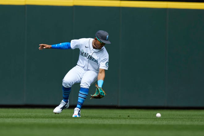 Mariners center fielder Julio Rodriguez makes a fielding error during the eighth inning Sunday's 4-0 loss to the Angels. Seattle lost four of five to L.A. for the series, including two shutouts in the last three games, sinking the M's ten games under .500 on the season.