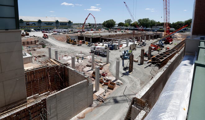 Construction crews work to build underground parking and expanded practice facilities at Lambeau Field on June 17. The project is scheduled for completion in 2023.