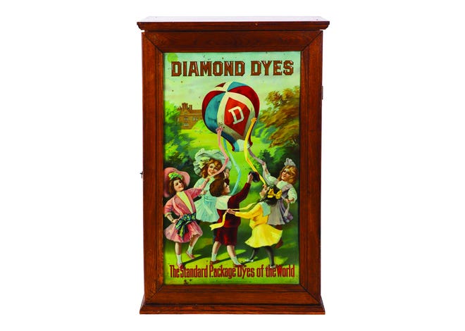 Diamond Dyes is a favorite company of collectors of antique advertising. Its advertisements featured vibrant images, like this cabinet with a scene of children playing.