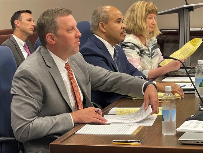 Spartanburg County Administrator Cole Alverson, left, provides an update Monday on the county's efforts to shelter stray animals. Pictured next to him are Deputy Administrator Earl Alexander and Clerk to Council Debbie Ziegler.