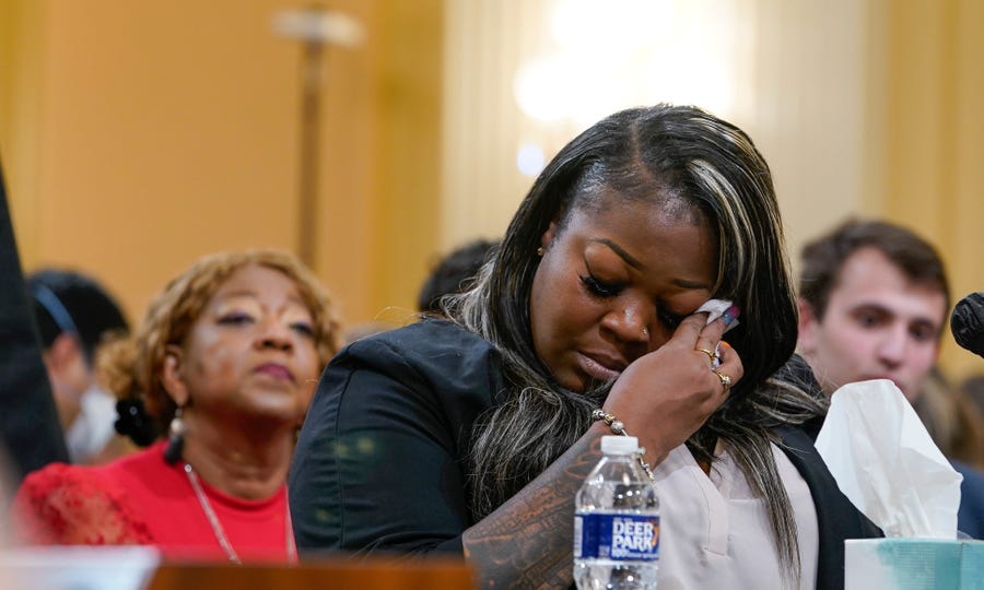 Wandrea "Shay" Moss, a former Georgia election worker, becomes emotional as she testifies before the committee to investigate the January 6 attack on the United States Capitol. Left is Ruby Freeman, Moss' mother.