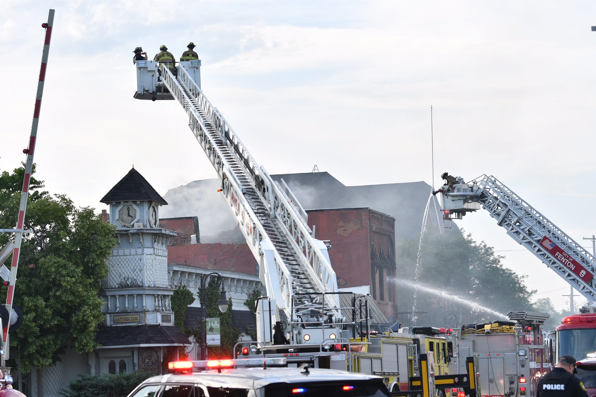 As flames lap at historic downtown Holly, residents vow to rally around