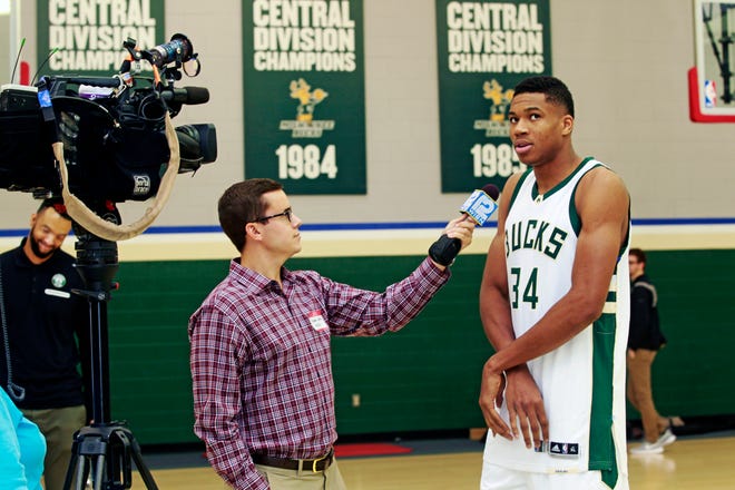 WISN-TV (Channel 12) sports reporter Stephen Watson, left, interviews a young GIannis Antetokounmpo at the Cousins Center in 2016. Watson is leaving Channel 12 after eight years at the Milwaukee ABC affiliate.