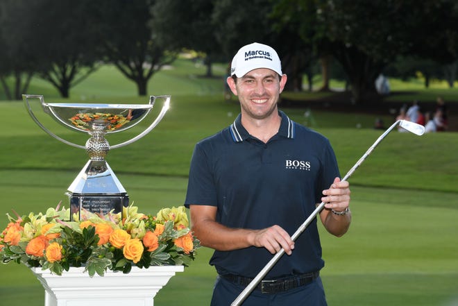 Patrick Cantlay celebrates after winning the 2021 FedEx Cup at the Tour Championship in Atlanta.