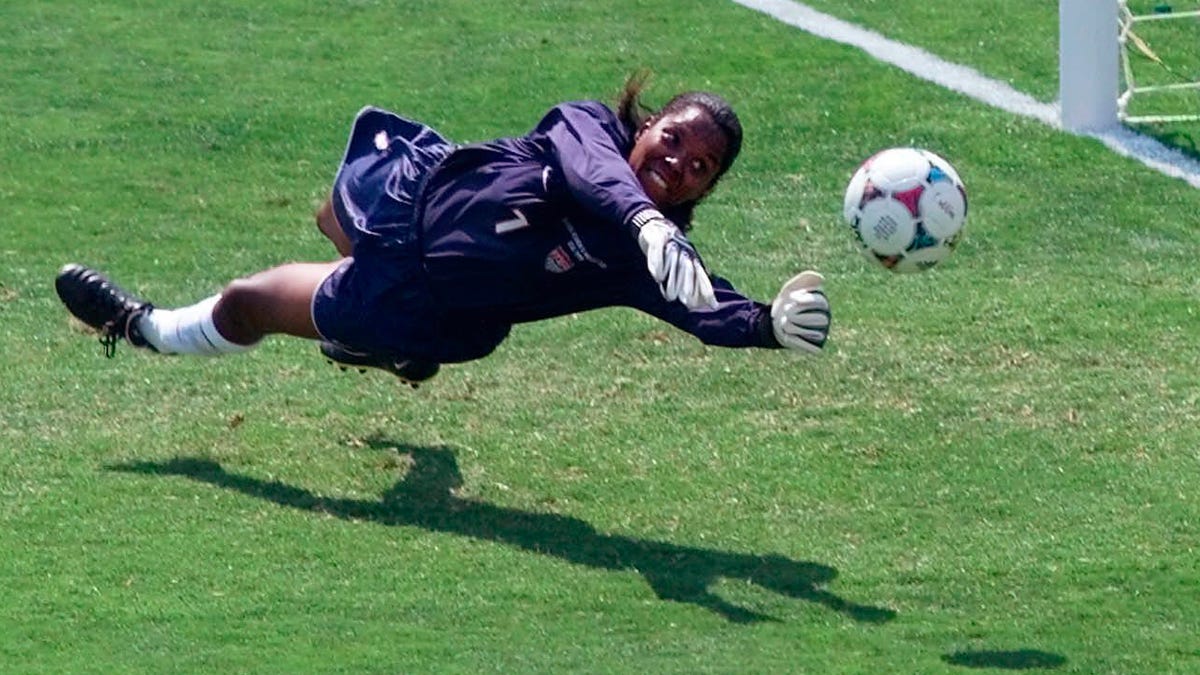Briana Scurry blocks a penalty shootout kick by China's Ying Liu during overtime of the Women's World Cup Final at the Rose Bowl.