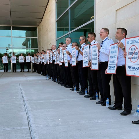Southwest Airlines pilots picket outside the termi