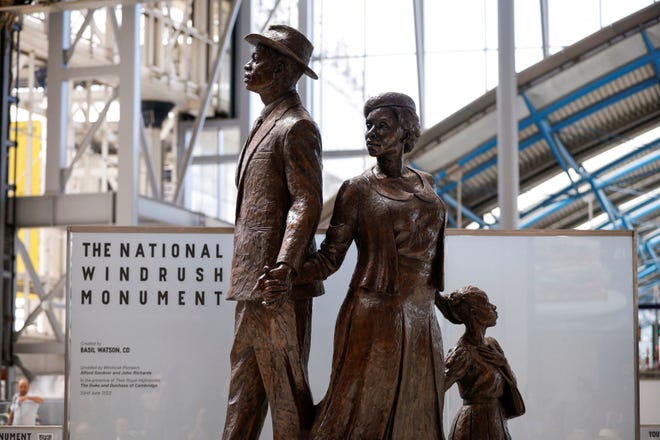 A view of National Windrush Monument unveiled at Waterloo Station in London, Wednesday, June 22, 2022. The unveiling of the statue - of a man, woman and child in their Sunday best standing on top of suitcases - will mark Windrush Day.