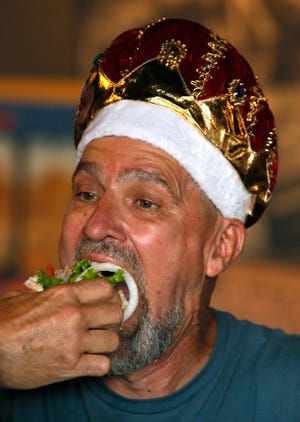 David “Coondog” O'Karma wears his crown as the honorary king for the 10th annual National Hamburger Festival in July 2015 in Akron.