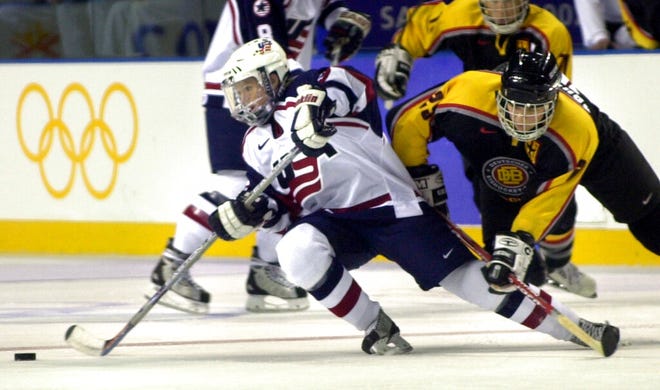 Brownstown Township's Shelley Looney, left, is checked by Germany's Sabine Ruckauer at the 2002 Salt Lake City Winter Olympics in Kearns, Utah.