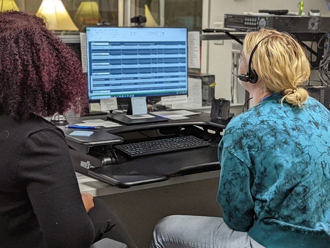 A counselor responds to a call at Wisconsin's National Suicide Prevention Lifeline call center, which is operated by Family Services of Northeast Wisconsin.