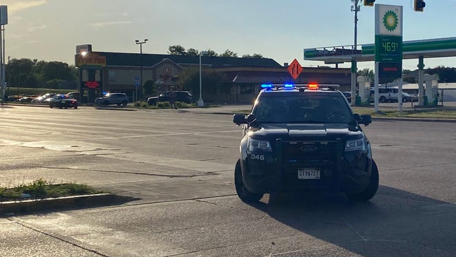 Police block 41st Street near I-29 after a shooting was reported in the area.