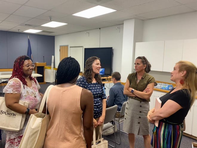 Diversity and Equity committee members chat with interim City Manager Leslie Beauregard and Mayor Andrea Oakes after the June 22 meeting.