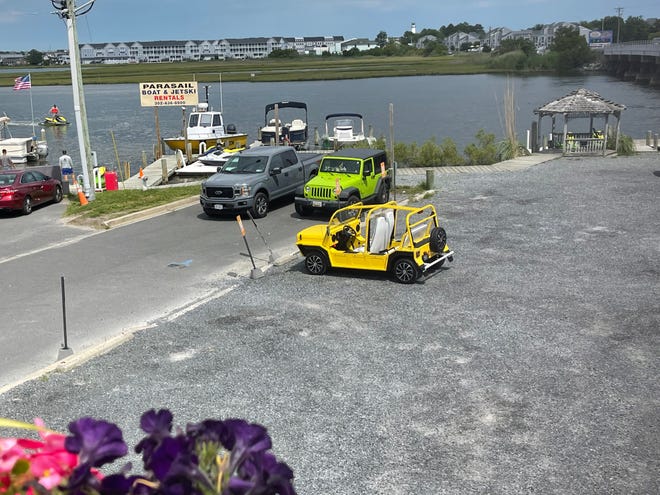 Kim Espinosa's Moke is insured and registered in the state of Delaware. She can no longer use it in Fenwick Island after the town enacted a ban on low-speed vehicles.