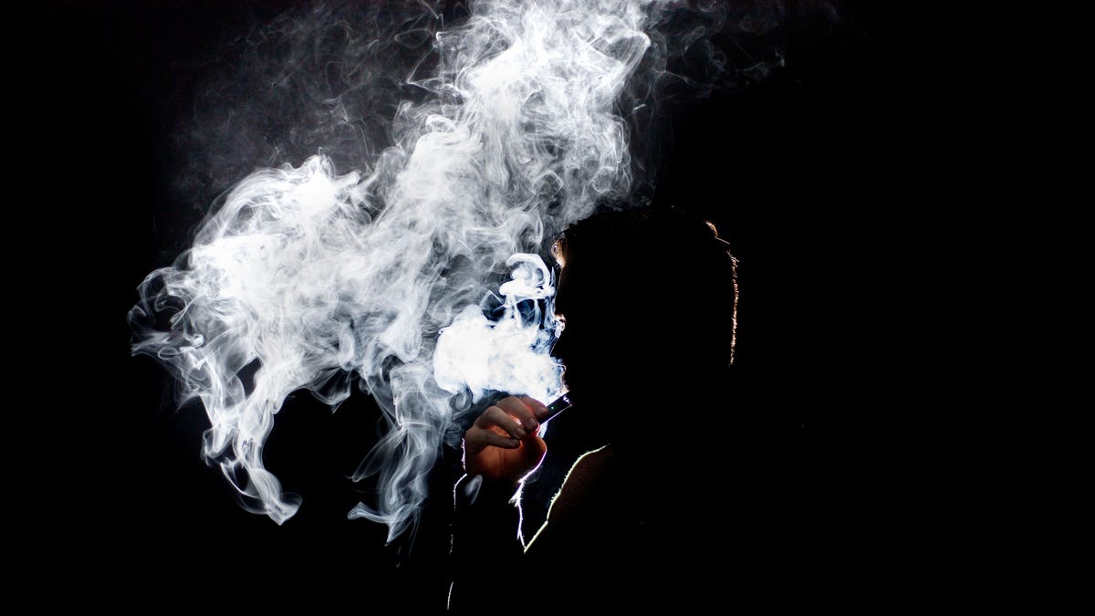 Man smoking a Juul e-cigarette.