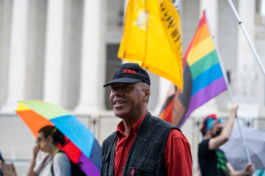 Steve Brown, 61, of Springfield, Va., celebrates after the Supreme Court struck down a New York  law that required people to show 