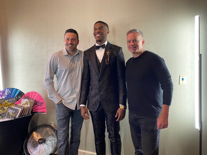 Ohio State's E.J. Liddell poses with former Ohio State assistant Ryan Pedon (left) and head coach Chris Holtmann at his NBA draft party at the St. Clair Country Club in Belleville, Illinois.