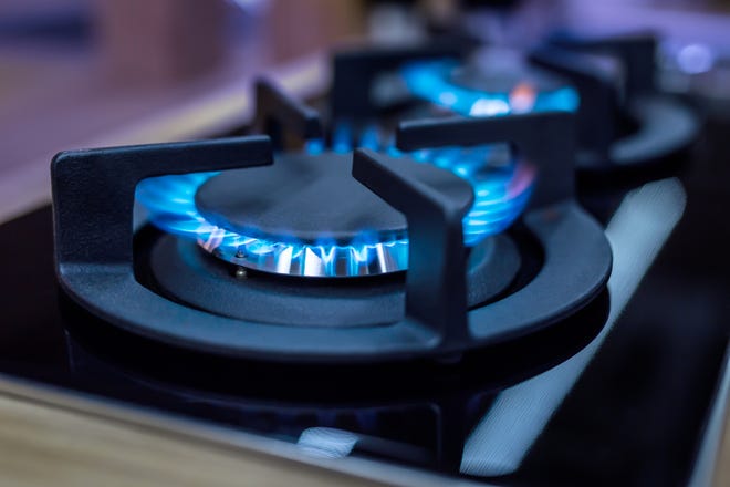 Stove with blue flames burning