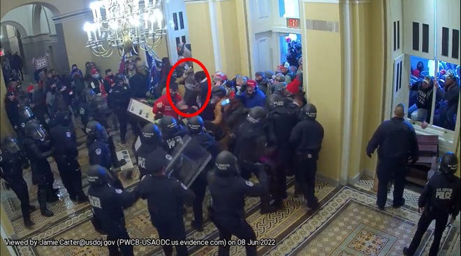 Prosecutors said Jonathan Carlton was part of this picture of rioters entering the U.S. Capitol after getting past police.
