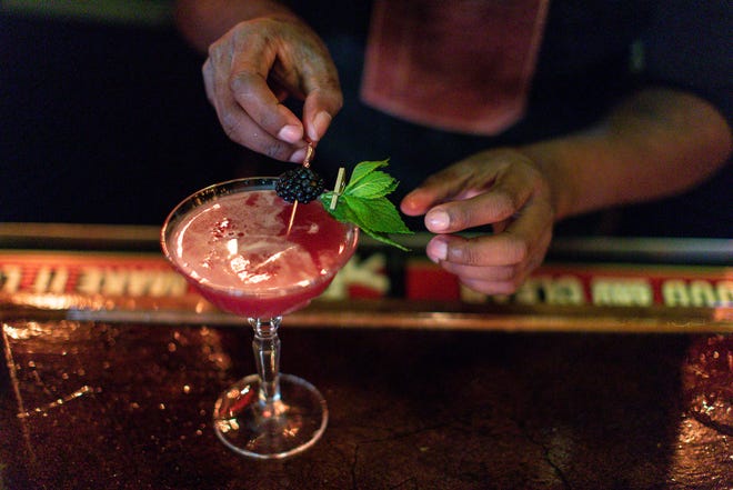 Bartender Kelley Brown prepares a cocktail named Idlewild at Willow in Detroit on Thursday, June 23, 2022.