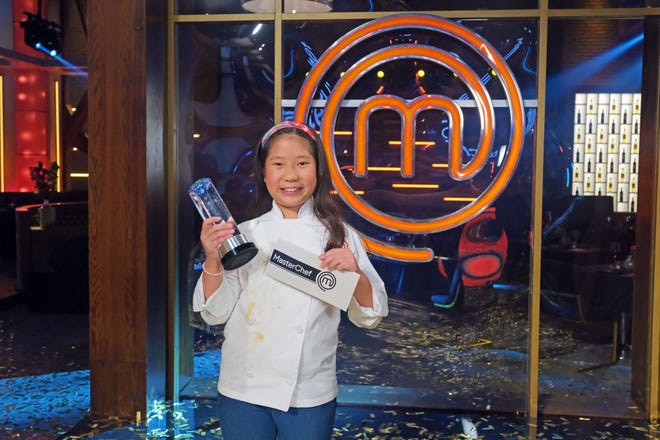Scarsdale resident Liya Chu with the winning check and trophy on the finale of Season Eight of MasterChef Junior.