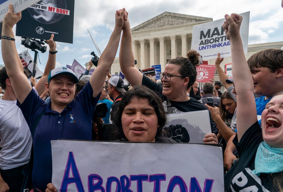 Anti-abortion protesters celebrate following Supreme Court's decision to overturn Roe v. Wade, federally protected right to abortion, in Washington, Friday, June 24, 2022.