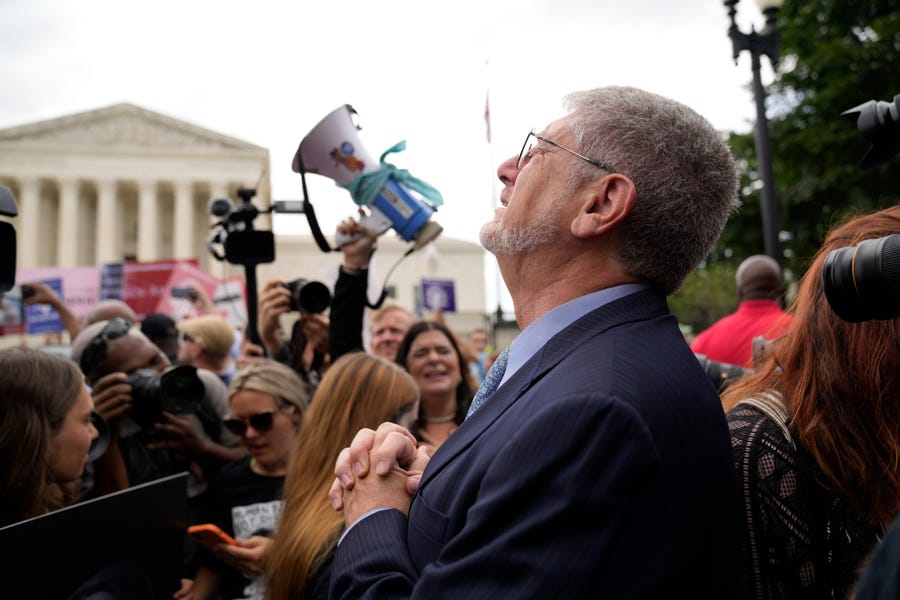 Demonstrators react outside the Supreme Court in Washington, Friday, June 24, 2022. The Supreme Court has ended constitutional protections for abortion that had been in place for nearly 50 years in a decision by its conservative majority to overturn Roe v. Wade.