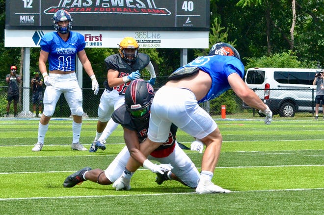 Livonia Churchill's Joshua Brown breaks up a pass during the fourth-annual Michigan High School Football Coaches Association's all-star game on Saturday, June 25, 2022, at Lawrence Tech University.