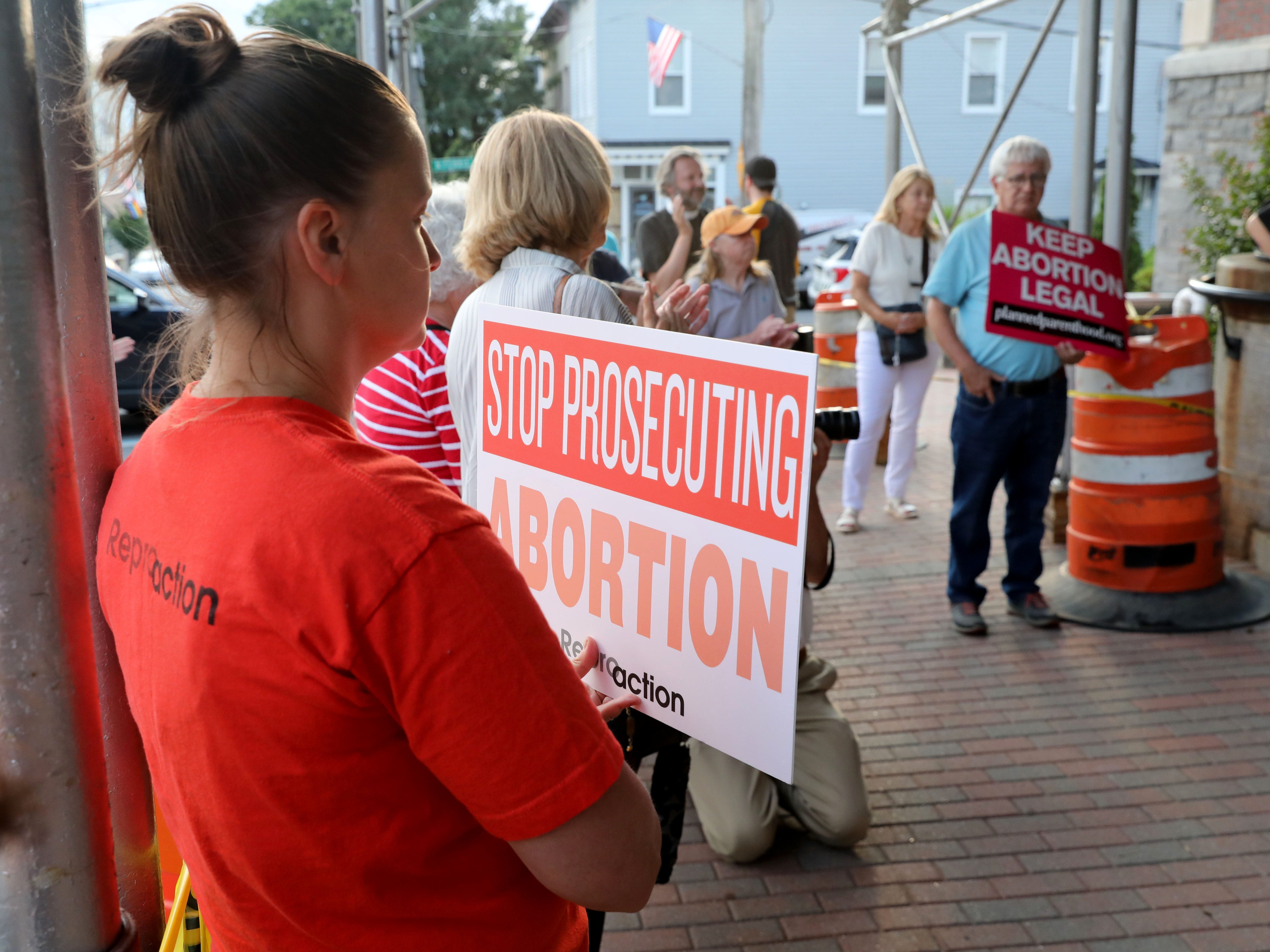 Elizabeth Skoski from Tarrytown holds a "Stop Prosecuting Abortion" sign during a gathering of abortion-rights concerned citizens in front of Irvington Town Hall, June 24, 2022. 