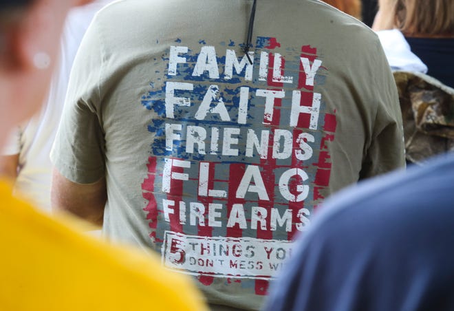 People listen to speakers during a pro-gun rights rally on the Legislative Mall in Dover, Saturday, June 25, 2022.
