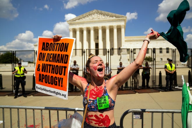 Jun 25, 2022: Washington, DC, USA; Caroline Rhodes, 23, of Bethesda, MD participates in a rally in front of the Supreme Court building Saturday, June 25, 2022, the day after the court's ruling on Dobbs v. Jackson Women's Health Organization.