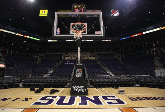 The Phoenix Suns logo is seen on the court before the NBA game against the Orlando Magic at US Airways Center.