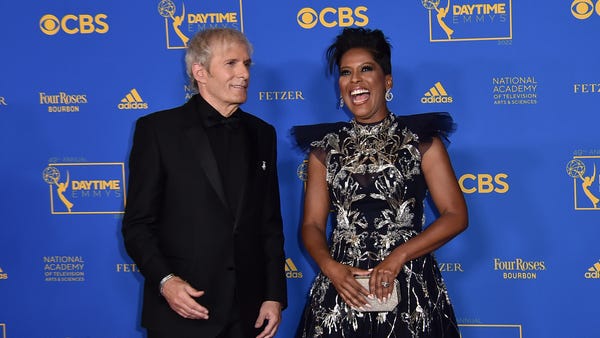 Michael Bolton, left, and Tamron Hall arrive at th