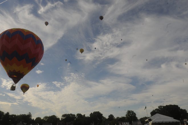 Balloons fill the sky during Saturday evening's balloon launch at Freer Field on Saturday for Ashland BalloonFest.