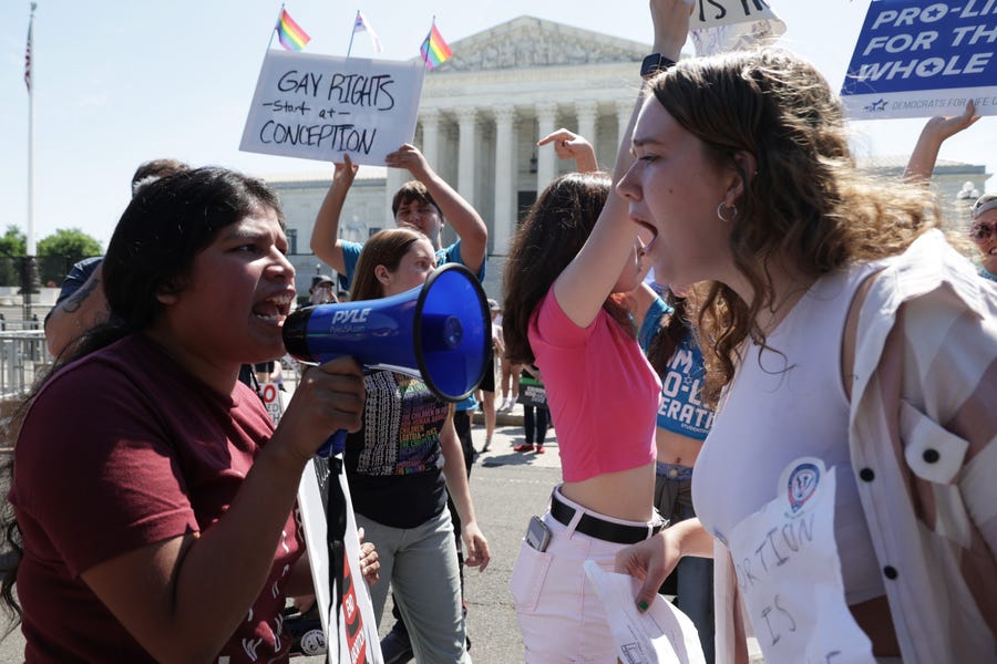 Abortion-rights activists argue with an anti-abortion activist (R) in front of the U.S. Supreme Court on June 25, 2022 in Washington, DC. The Supreme Court's decision in Dobbs v Jackson Women's Health overturned the landmark 50-year-old Roe v Wade case and erased a federal right to an abortion.