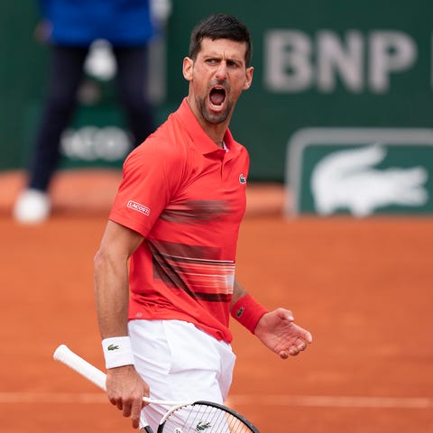 Novak Djokovic reacts to a point during his match 