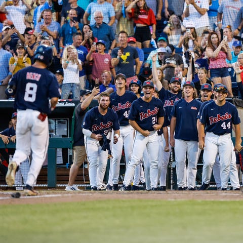 Justin Bench (8) finishes his home run trot after 