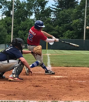 Cambridge Post 84's Blake Brumfield connects during Sunday's championship game with Wheeling Wild Things in the Coshocton Post 65 Ben Tufford Memorial tournament at Lake Park in Coshocton.