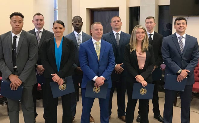 The Erie Bureau of Police on June 27, 2022, swore in nine new officers, boosting its complement to 183 officers. The new officers are, front row from left, Joshua M. Nelson, Rebecca A. Gross, Terrance M. Dawdy, Destiny L. Glass, and Luigi J. Yates. Back row from left, William P. Barber, Tyshawn A. Parker, Ryan S. Oakley, and Alex S. Miller.