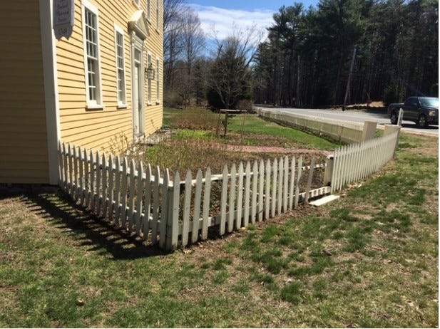 Fall 2021 photo showing the shabby picket fence enclosing the Holyoke-French House and Parlor Garden area
