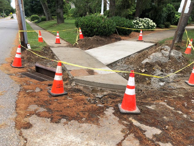 The city of Asheville has been working on a sidewalk and ramps project on Sunset Parkway at Charlotte Street. Some of the work needed "adjustments" that cost an additional $8,000.