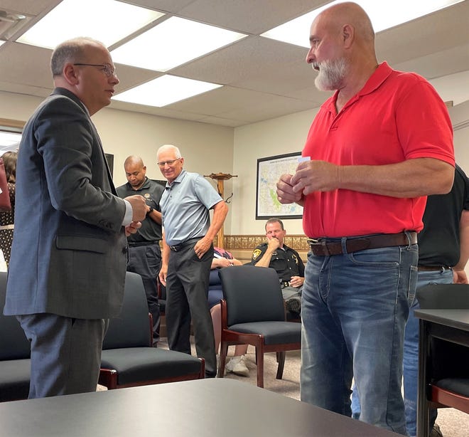 Sen. Andrew Brenner of the Ohio Senate talks with Commissioner Rick Conkle during a recent visit to Coshocton County. Brenner is the Republican candidate for the new 19th District that will include Delaware, Knox, Holmes and Coshocton counties.